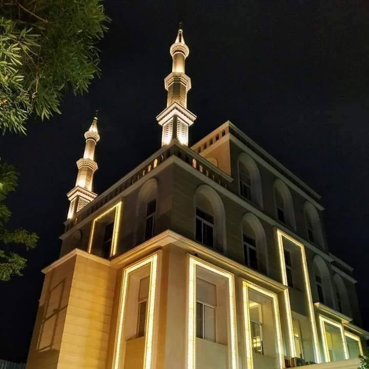 Masjid e Baqi minarets at night